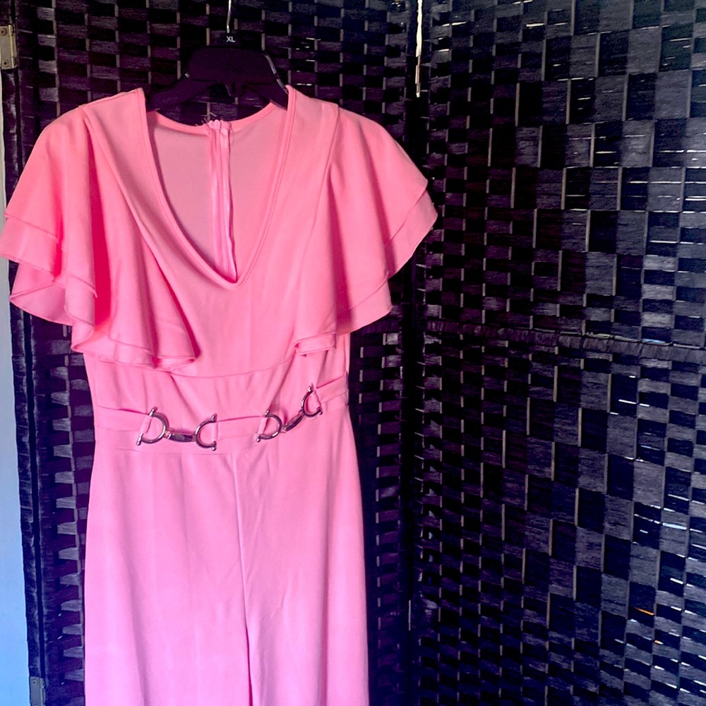 NWOT pink jumpsuit with silver accessories attached v neck line back zipper